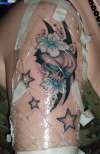 skull, stars, flowers tattoo