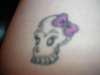 skull with bow tattoo