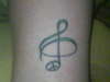 Treble clef/Peace sign tattoo