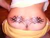 tribal on lower back.. shitty camera tattoo