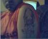 Demon on left arm tattoo