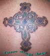 collored cross tattoo