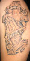 praying hands and cross tattoo