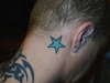 star behind ear tattoo