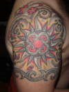 sun and arm band fanga tattoo