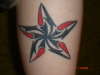 Tribal teardrop star tattoo