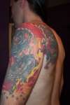 back of arm and shoulder tattoo