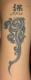 Swirly Design and Protect tattoo