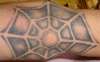 Spiderweb on elbow tattoo