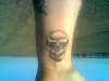 Skull on wrist tattoo