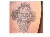 Skull and cross tattoo