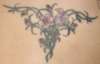 Flowers on lower back tattoo