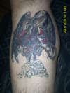Demon with whip tattoo