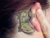 Gecko around my ear tattoo