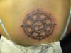 buddhist wheel of law tattoo