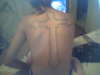 cross on back tattoo