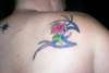 Flower Against Tribal design tattoo