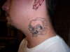 skull neck tattoo