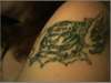 tiger ripping thru skin tattoo