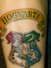 Hogwarts-on leg by the ankle tattoo