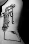 skeleton/syringe/dead tree tattoo