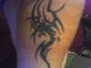 forearm tribal dragon tattoo