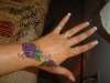 Hand Tat tattoo