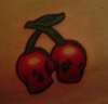 skull cherries tattoo