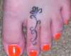 Toe flower tattoo