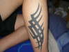 tribal leg tattoo