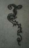 Calligraphy 'T' tattoo