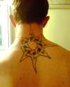 celtis sun back centred on neck bone tattoo