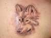 faded wolf tattoo