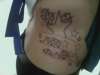 Stars on side tattoo