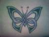 Woven Butterfly(lower back) tattoo