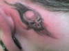 Skull head tat tattoo