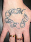 LETTERING ON HAND tattoo