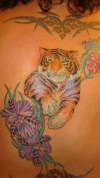 Tiger and hibiscus tattoo