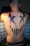 Mushroomhead X-Face tattoo