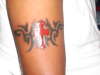 red tribal cross tattoo