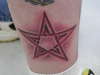cut-out star tattoo