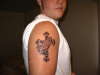 praying hands and a cross tattoo