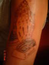 praying hands with sons name tattoo
