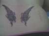 My angel cate eye wings tattoo