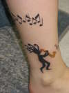 Aug 2007 - Kokopelli & Sax Ankle Wrap tattoo