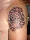 Lion with Crown of thorns tattoo