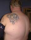 monster on back tattoo
