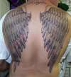 Wings on back tattoo