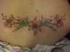 flower on lower back tattoo