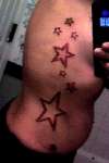 rib stars tattoo